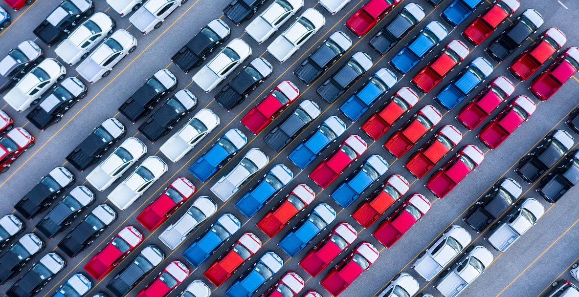 An aerial image of cars parked in a company lot