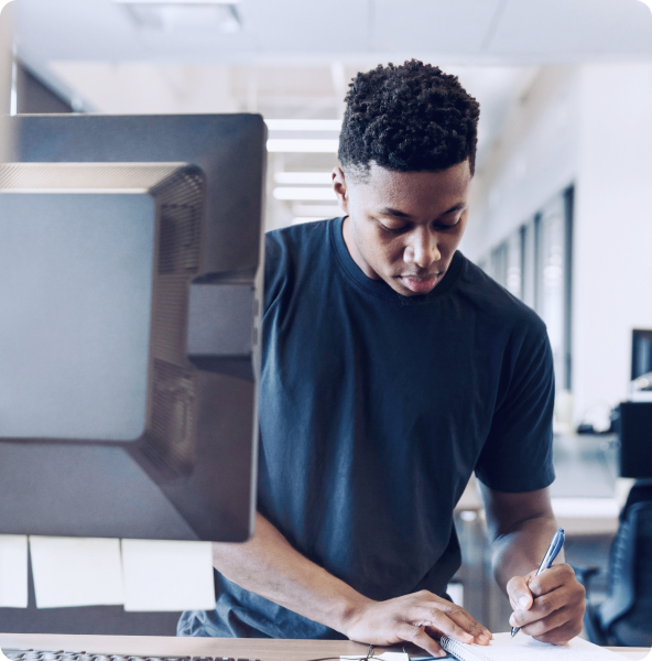 Photo of a man working at a computer