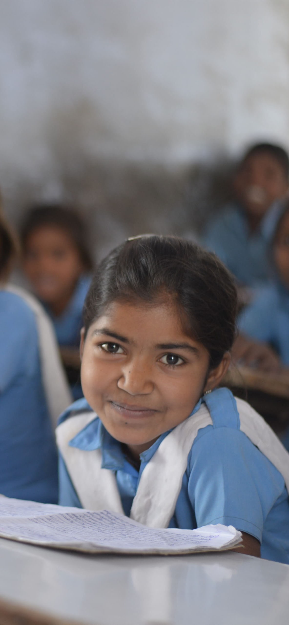 Children smiling in a classroom