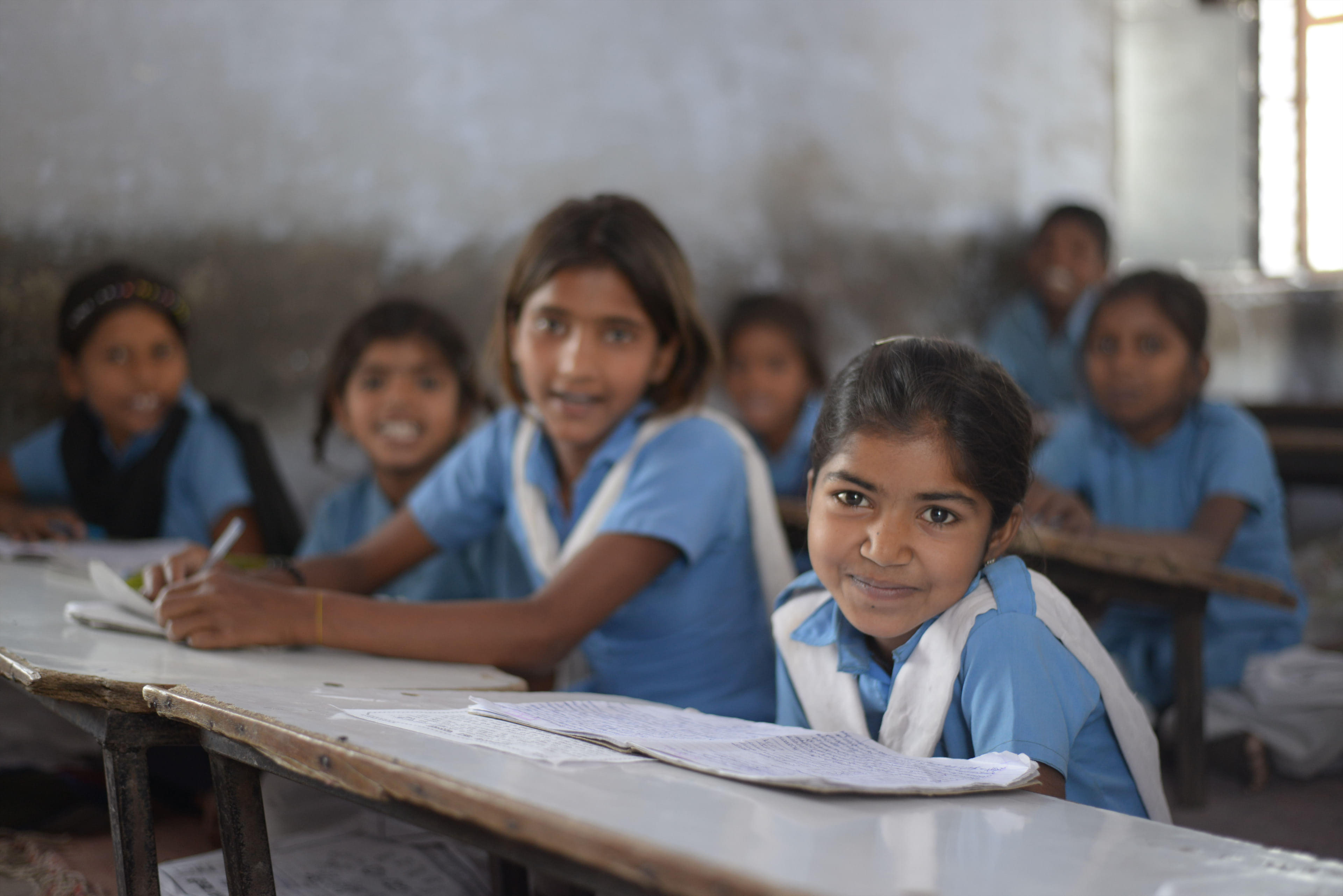 Children smiling in a classroom