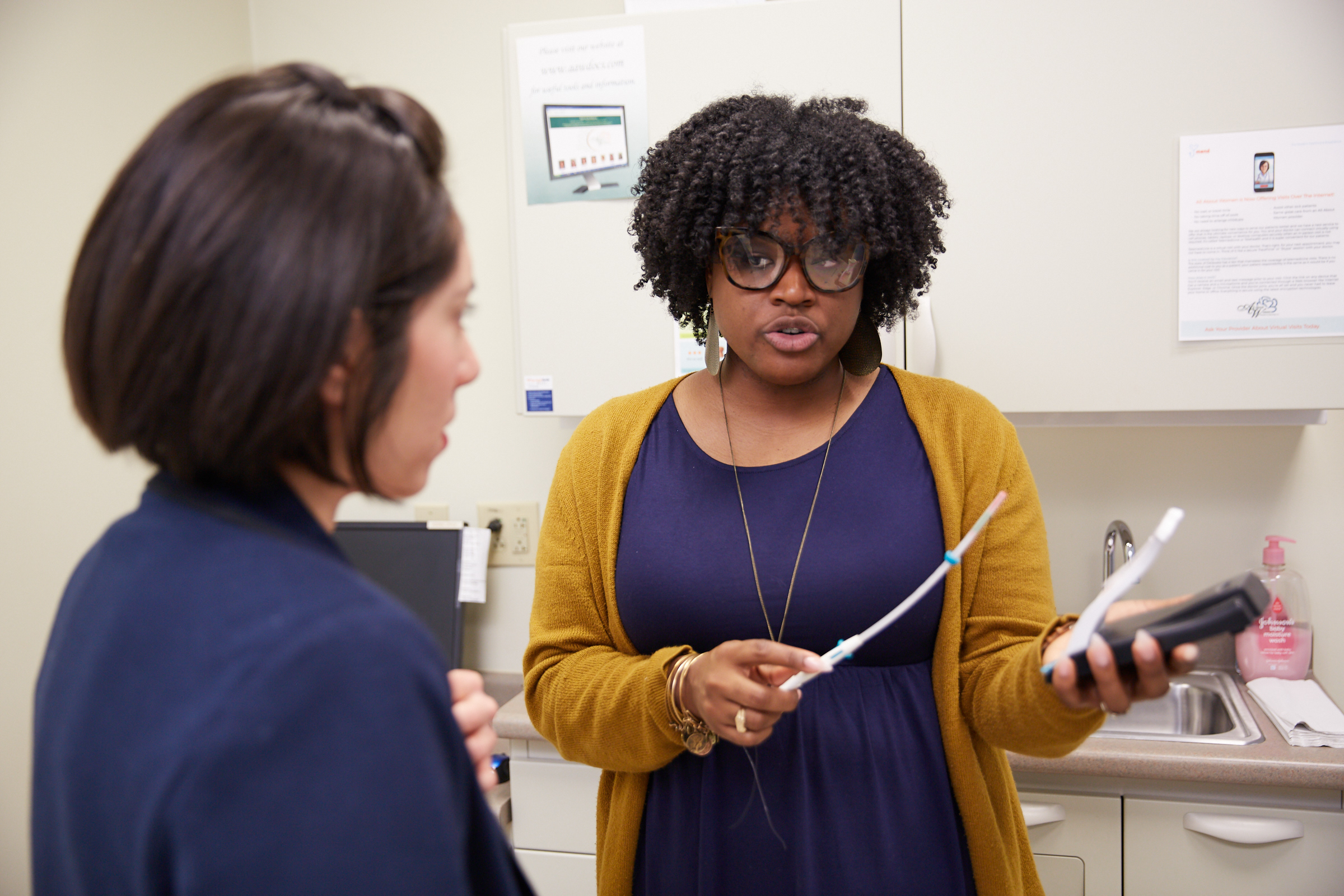 healthcare worker talking to a patient 