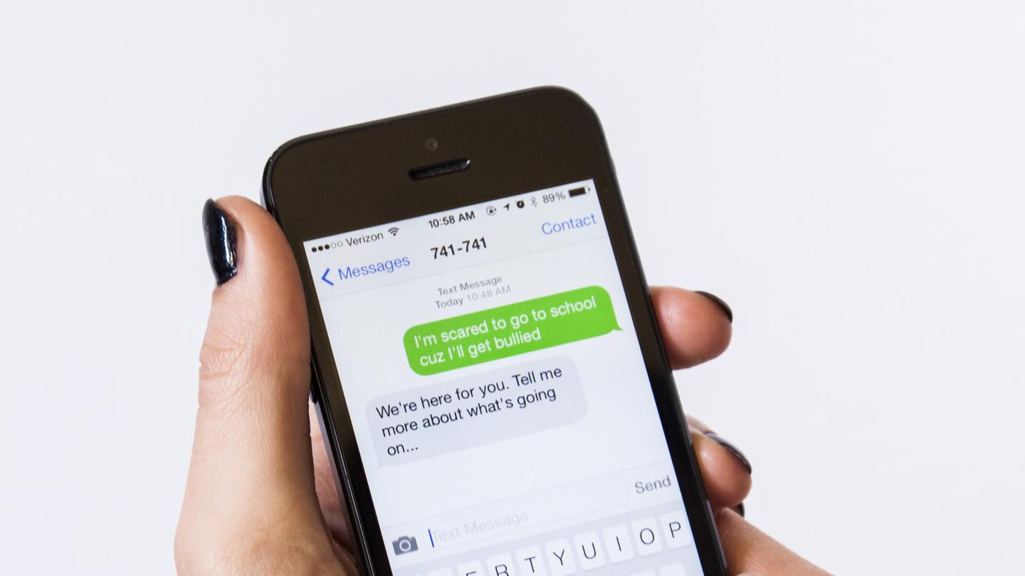 a mobile phone with a crisis text message 