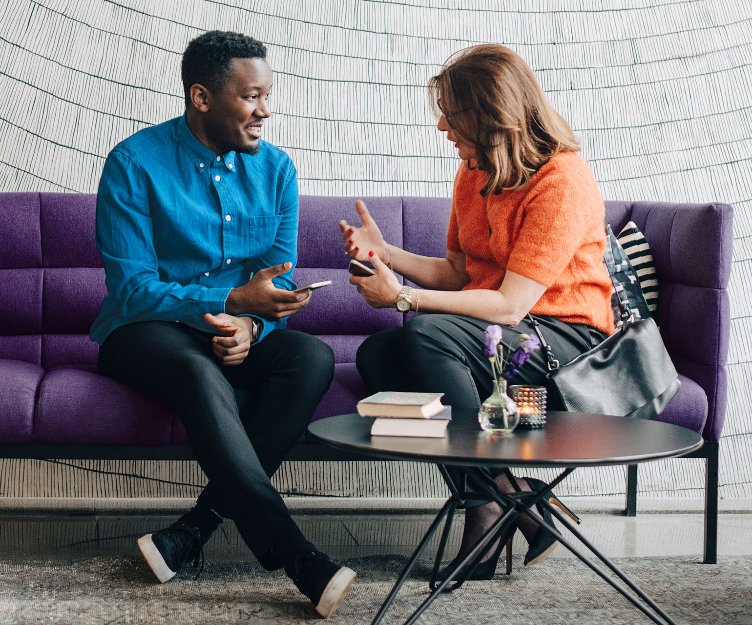 People having a conversation on a couch