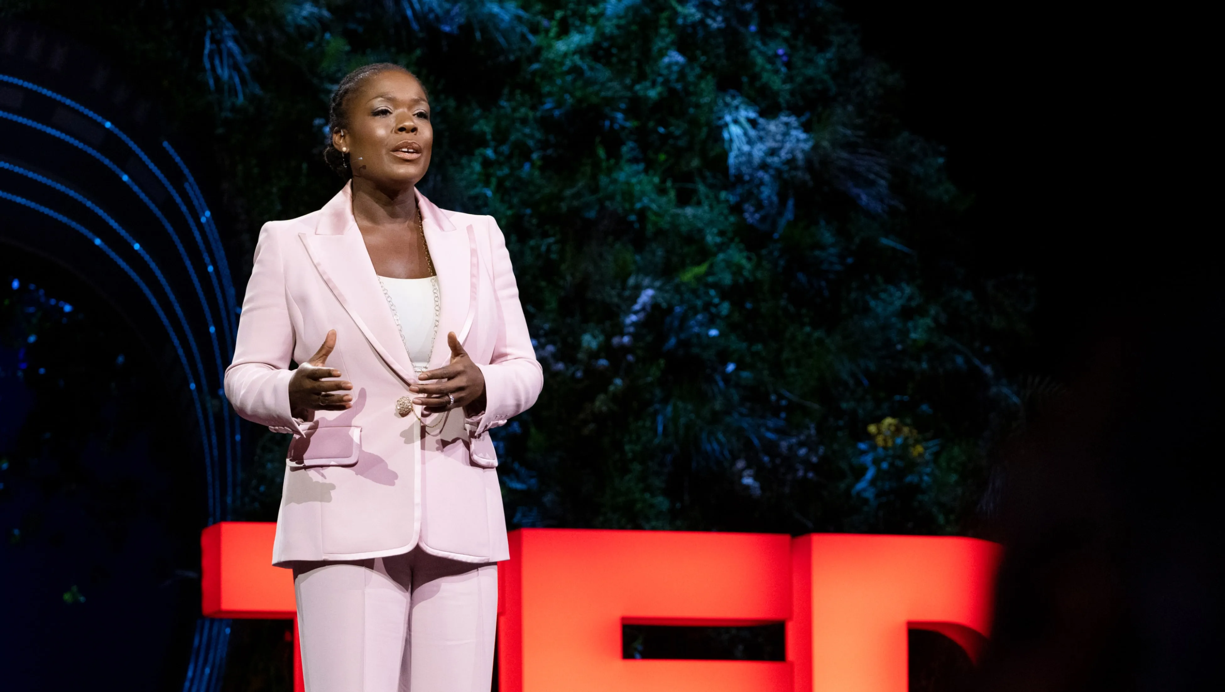 A woman delivers a TED Talk from the theater in Vancouver.