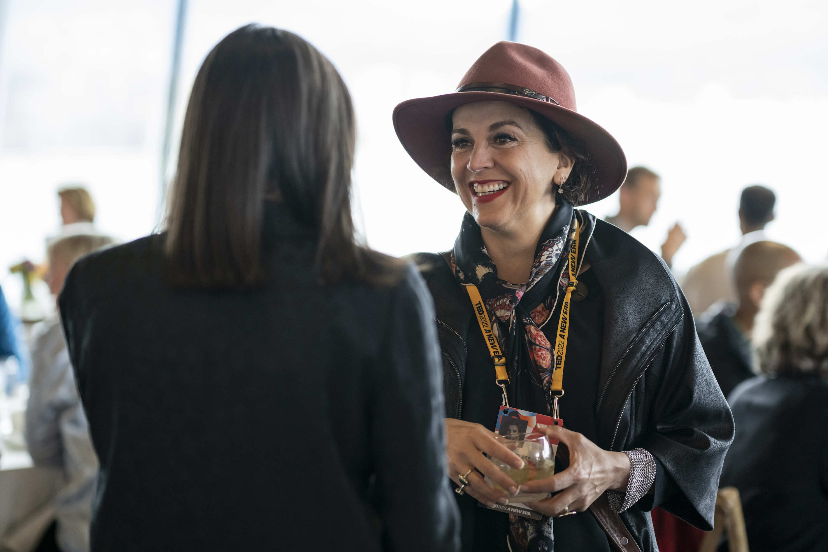 Two women chat at TED Conference: New Era