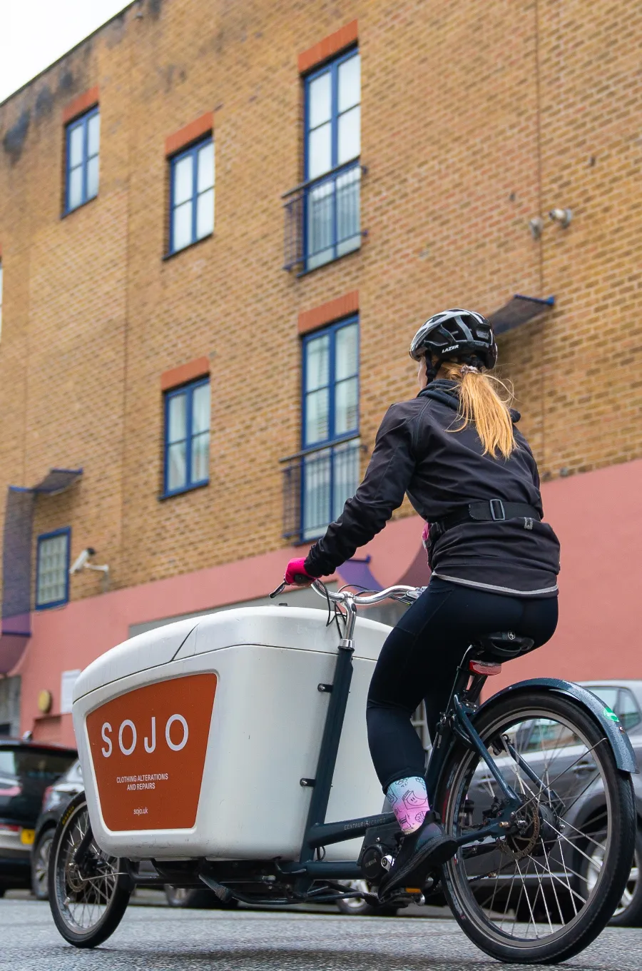 SOJO delivery bike delivering tailored and repair clothing to customers' homes.