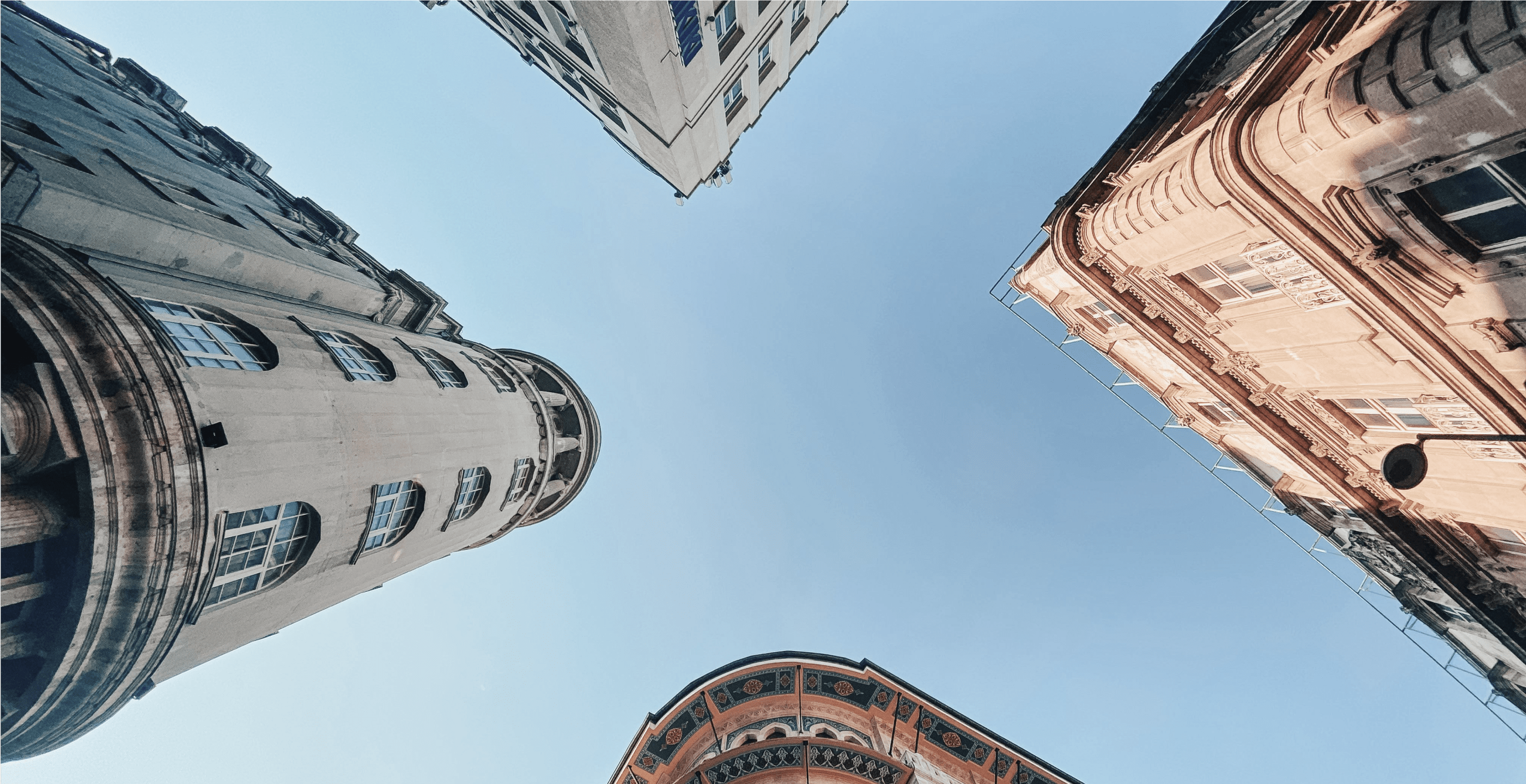 Image of city buildings from a ground POV. 