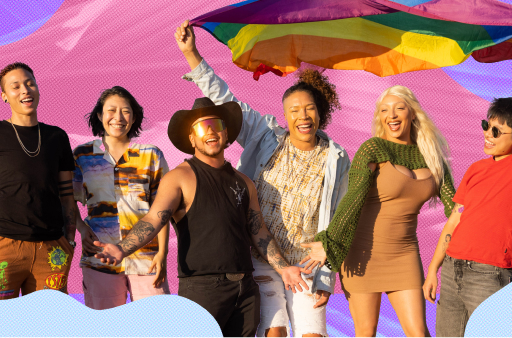 A group of people are standing under a rainbow colored pride flag.