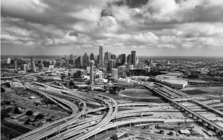 Aerial photograph of the Dallas skyline and a highway intersection