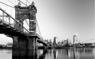 Photograph of a bridge and the Cincinnati skyline
