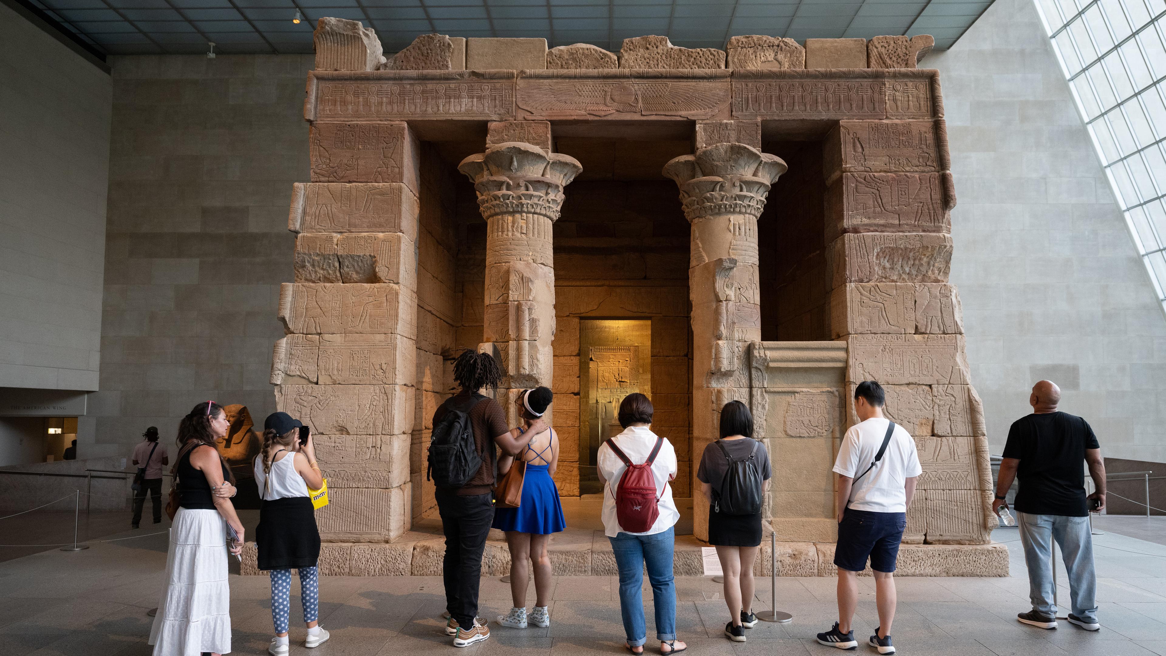 Group in gallery looking at the Temple of Dendur.