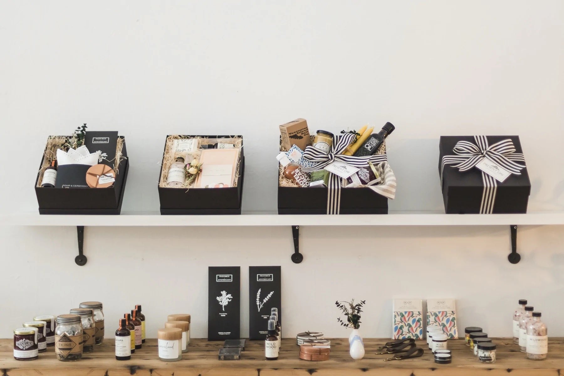 A wall in a retail store showcases multiple gift sets on shelves