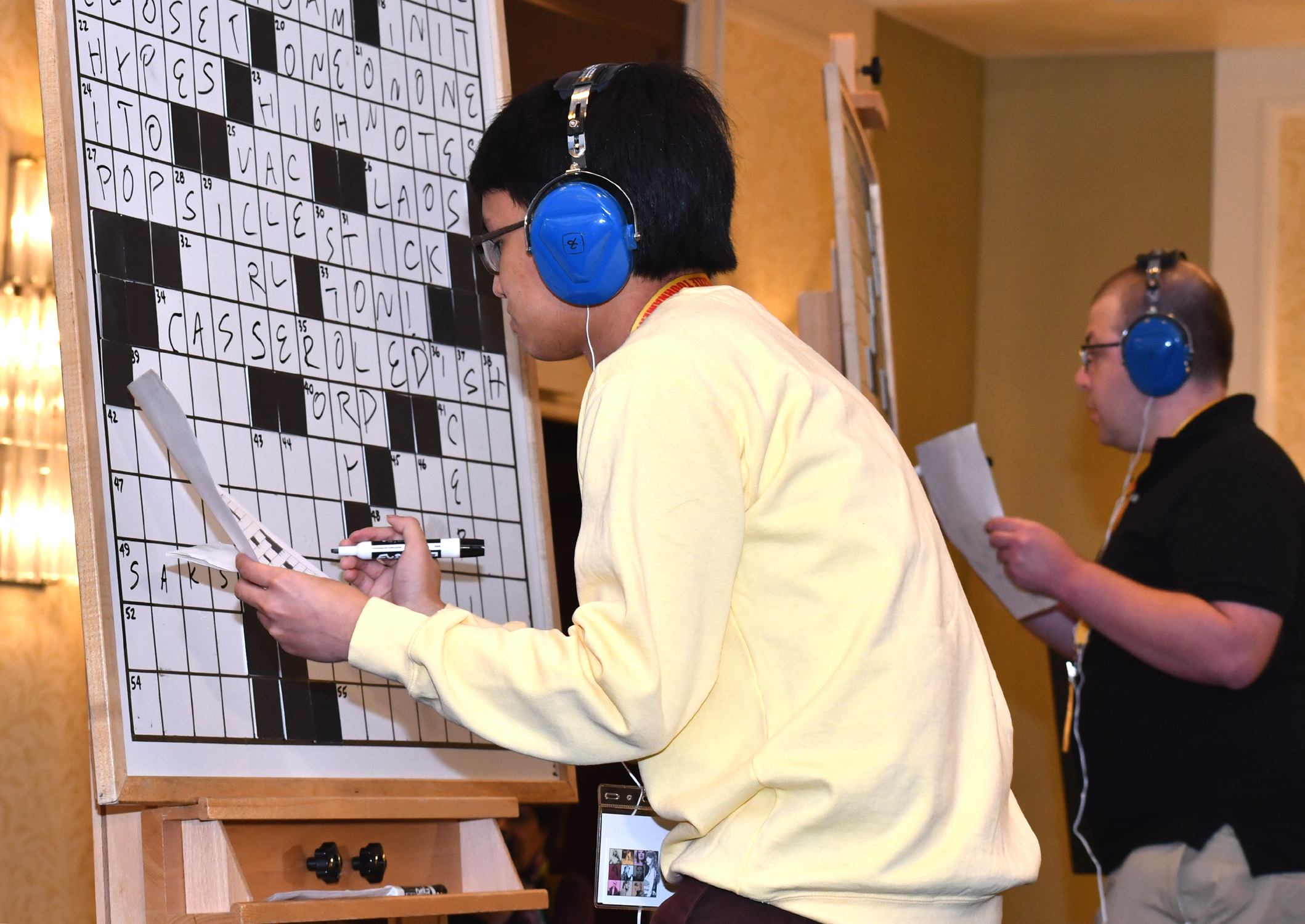 A photo of Paolo Pasco in the midst of completing his crossword puzzle