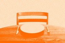 An orange image of an empty chair and an empty plate on a table