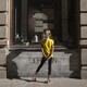 A girl looks into a shop window