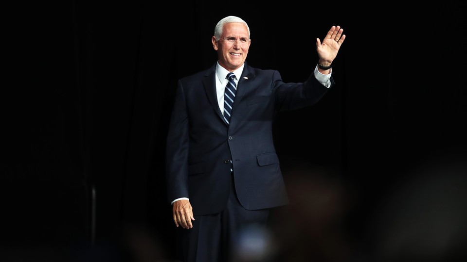 A photo of Mike Pence waving