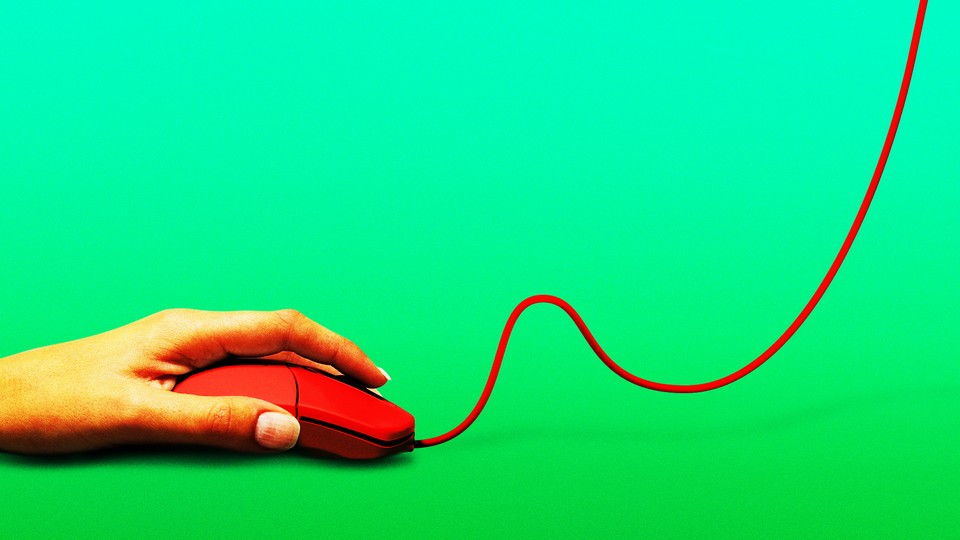 hand on a computer mouse; the mouse cable rises upward, out of frame