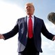 A photo of Donald Trump speaking in front of a boom microphone