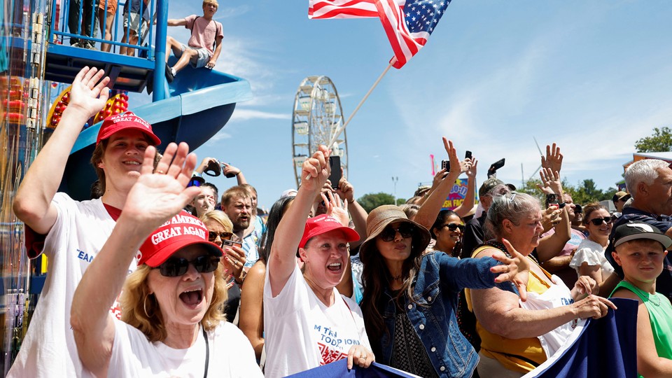 A photo of enthusiastic Trump supporters at the Iowa State Fair.