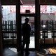 Owner and chef Anthony Caldwell looks out from 50Kitchen in the Field's Corner neighborhood of Boston on March 18. His grand opening of the restaurant was three weeks ago, but because of the coronavirus, the restaurant has switched to takeout-only.