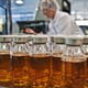 Bottles with blood plasma derivatives stand on a packing plant at the Octapharma company in Dessau, eastern Germany.