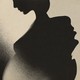 A pregnant person's silhouette