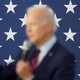 a blurred photo of Joe Biden against a star background