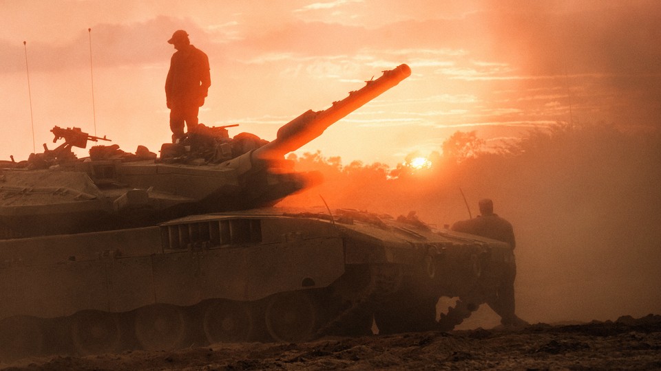 A man standing on top of a tank