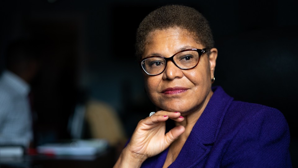 Karen Bass looks into the distance.