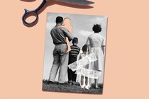 A black and white photo of a family facing away from the camera, with a cut-out where a child should be in its fathers arms