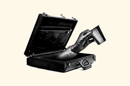 A hand reaching out of a briefcase, begging