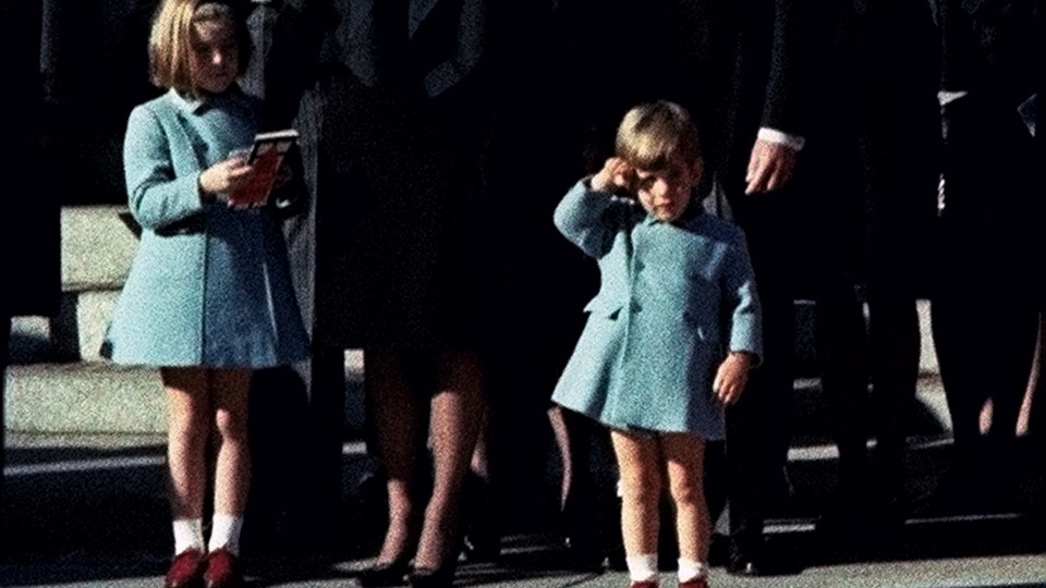 Three-year-old John Kennedy Jr. salutes his father's casket as it leaves the Cathedral of St. Matthew the Apostle in Washington, D.C., en route to Arlington National Cemetery.