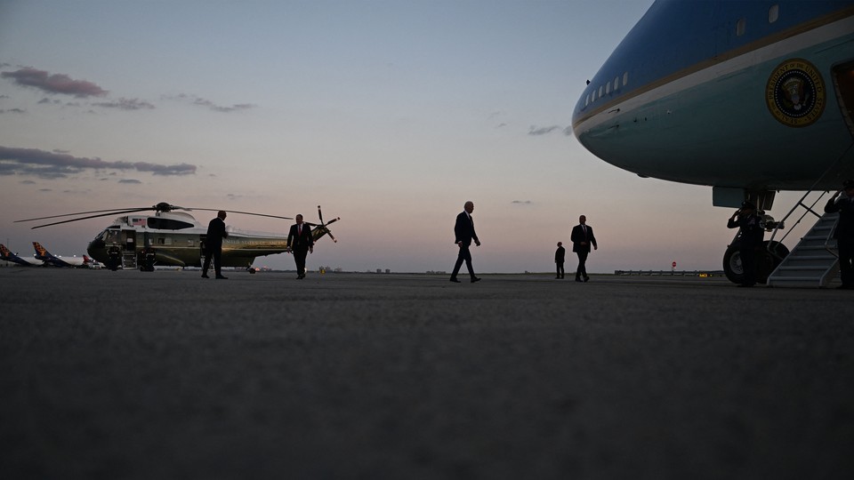 Biden walks across the tarmac