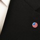 a flag pin on a suit lapel