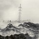 A high-voltage electricity pylon behind a plume of smoke from burning garbage, mostly plastic and textiles, at the Gioto dumpsite