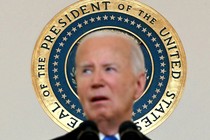 An image of Joe Biden with the POTUS seal in the background