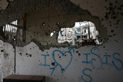 Graffiti that reads "I love ISIS" is seen in a damaged building in Marawi City, Philippines.
