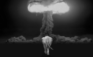 A photo-illustration of an elephant walking toward a nuclear detonation