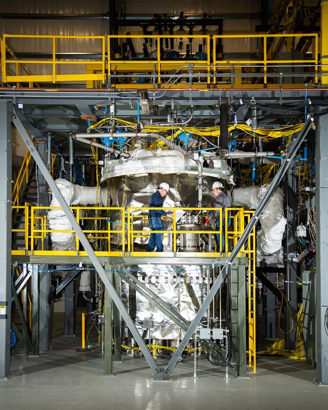 Photographs of two people in hard hats working on a test nuclear unit