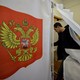 A man enters a polling booth in Russia's 2018 presidential elections.