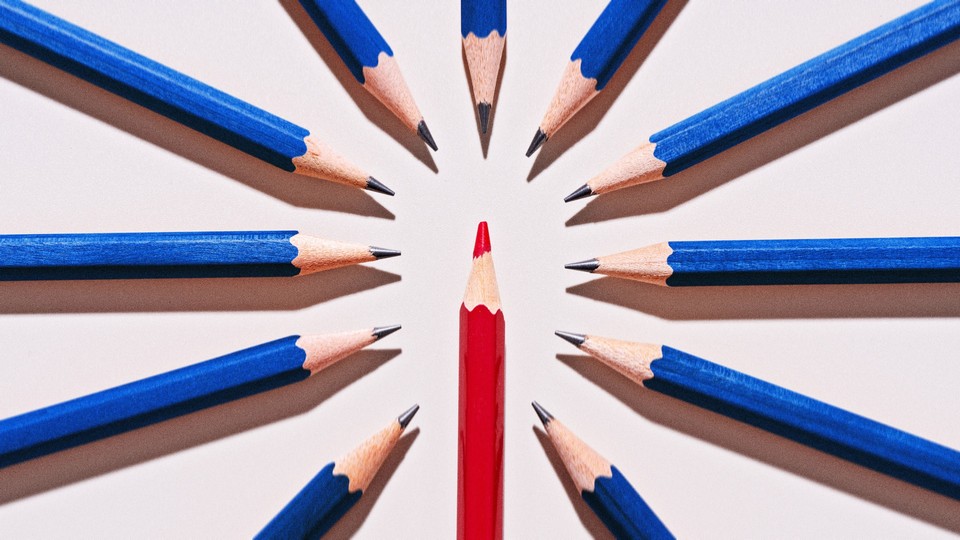 Blue pencils pointing at a red one