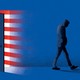 an illustration of a silhouette of a man walking away from an open door, the colors of an American flag bleeding out of it