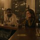 A still from the Apple TV+ series 'Slow Horses' showing two characters sitting at a bar