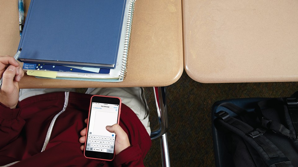 A student looking at their phone