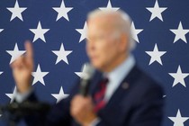 a blurred photo of Joe Biden against a star background