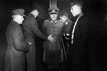 A German military leader is tied to a stake before his execution