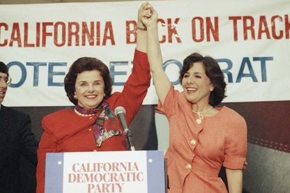 Dianne Feinstein and Barbara Boxer raise their hands in victory after securing the Democratic nominations for California's Senate seats.
