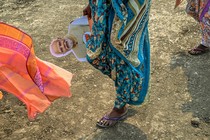 a supporter of Prime Minister Narendra Modi with a cutout of his face at a campaign rally in Chandrapur, India, on April 8, 2024.