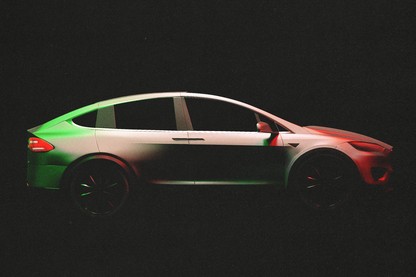 An electric car painted red, white, and green