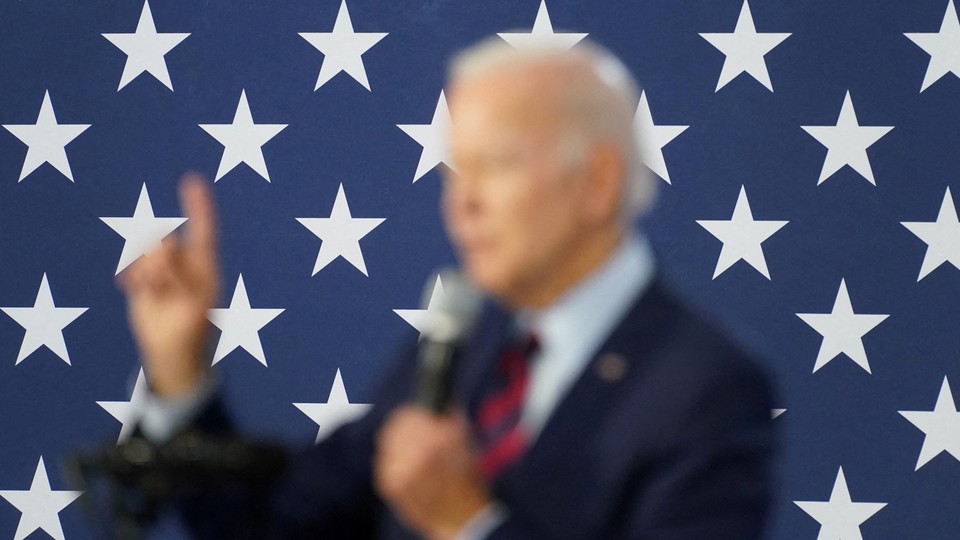 a blurred photo of Joe Biden against a star background